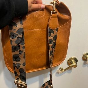 Ah-dorned leather crossbody bag